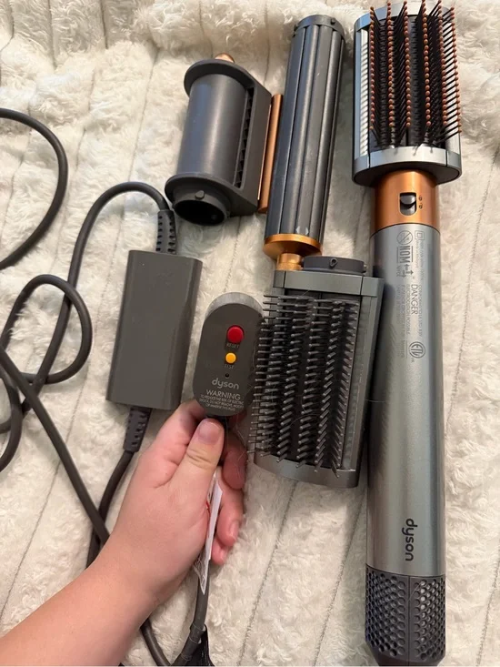Dyson styling brush set in gunmetal gray and copper accents