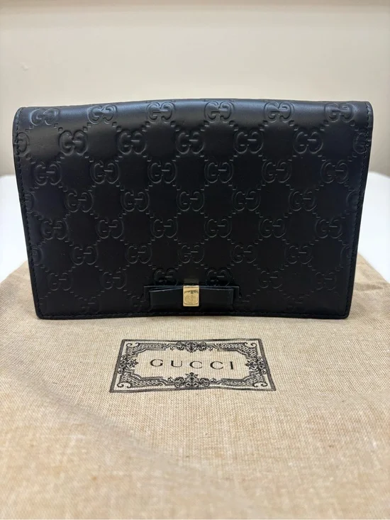 Gucci Black Embossed GG Crossbody Bag with Bow Accent