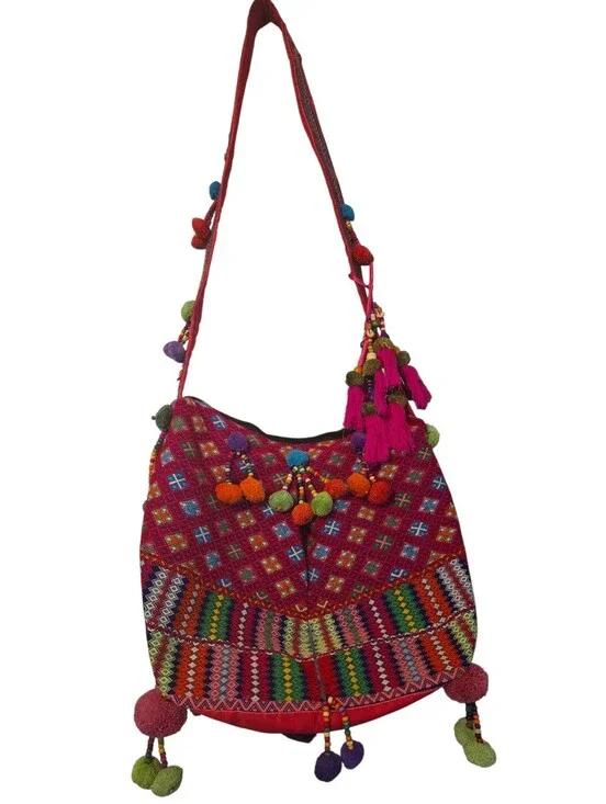 Colorful, handcrafted bohemian shoulder bag with traditional woven details