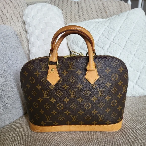 Authentic Louis Vuitton Monogram Alma PM Hand Bag..