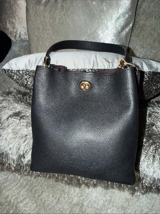 Coach bucket bag, likely the Charlie or Town model