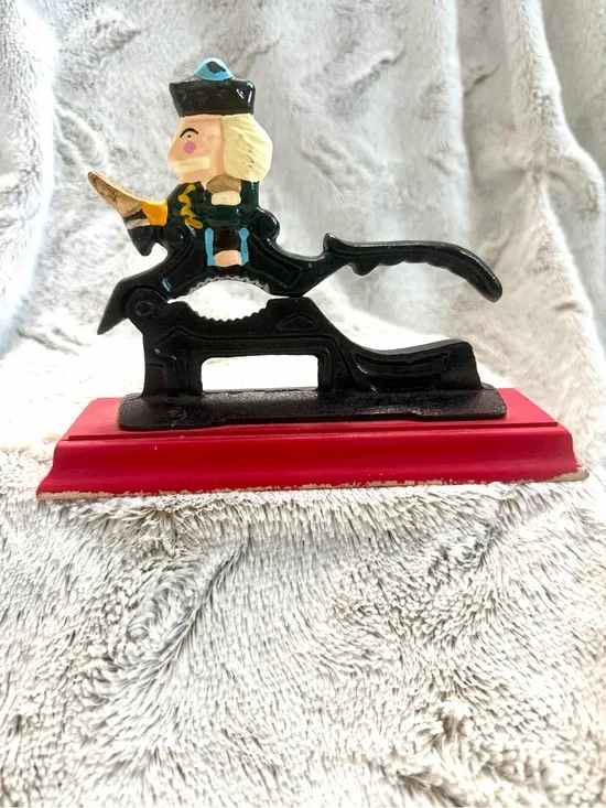 Vintage Cast Iron Nutcracker Figurine on Red Base