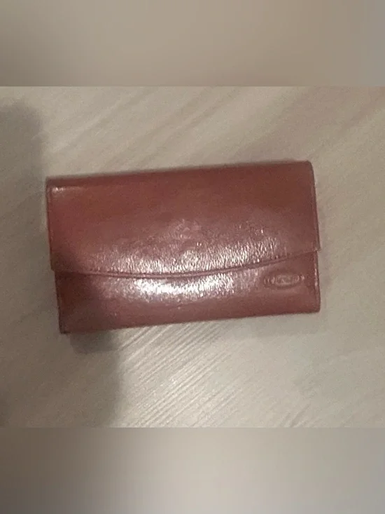 Rolfs brown leather card case with gold detail