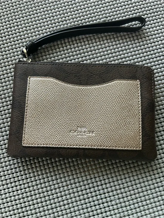 Coach dark brown signature and metallic wristlet