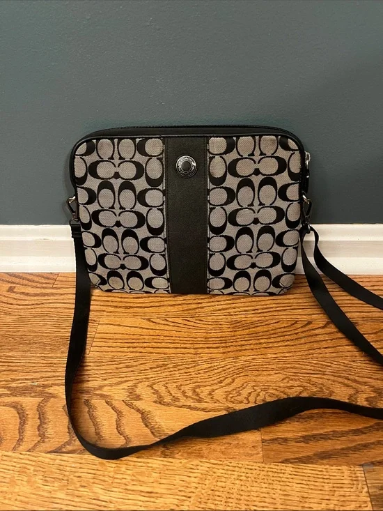 Coach signature monogram padded tablet case with a black stripe