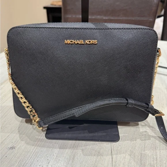 Michael Kors Elegant Black Crossbody Bag with Gold Accents