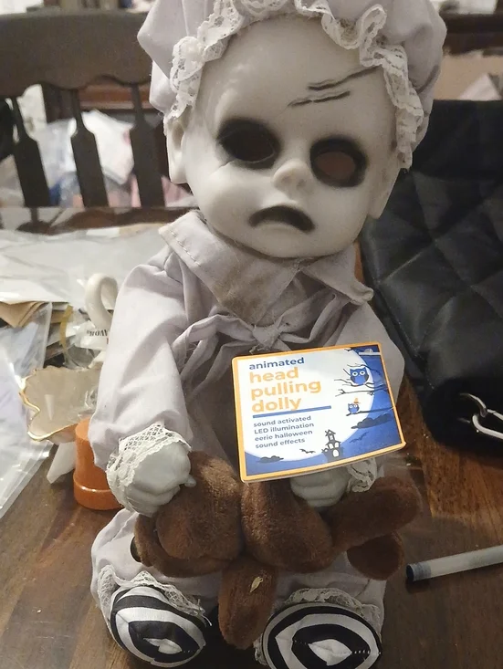 Animated Head Pulling Doll - Gray with Black and Brown Accents