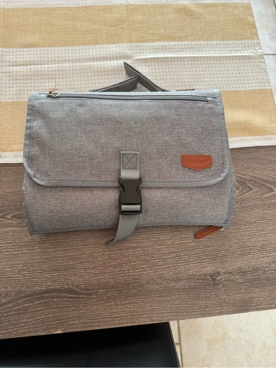 Travel diaper changing pad and storage