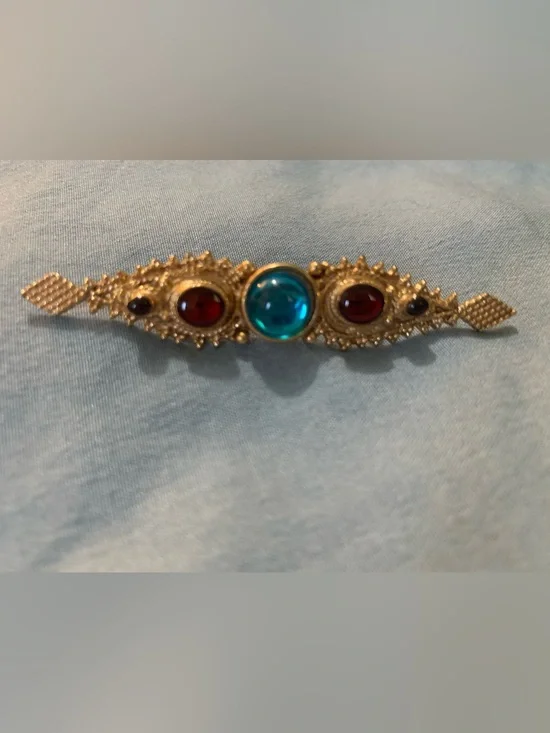 1928 Jewelry Company Gold-Tone Brooch with Teal Center and Red Accent Stones
