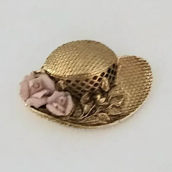 Vintage gold color hat brooch pin with floral accent