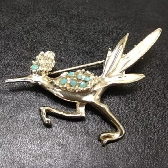 Silver tone vintage roadrunner brooch.