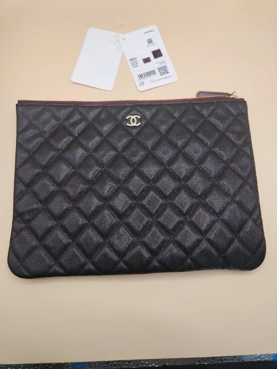CHANEL Black Quilted Caviar Leather Pouch with Gold CC