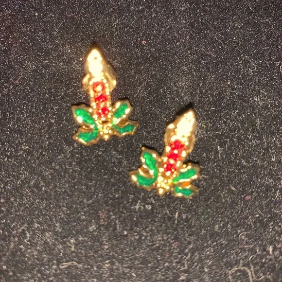 A set of Candles burning in a bed of ivy earrings