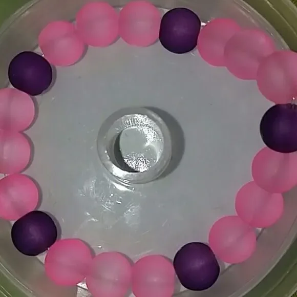 2 Light pink and purple beaded bracelets