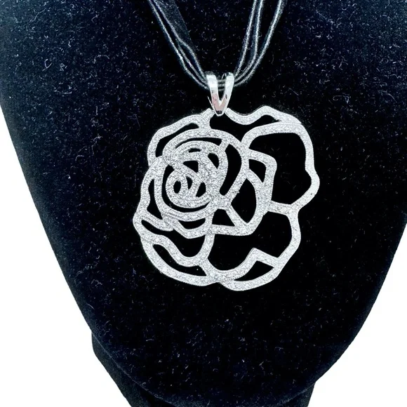 STERLING SILVER OPEN FLOWER PENDANT W MICRO PAVE STONES ON BLACK SUEDE NECKLACE
