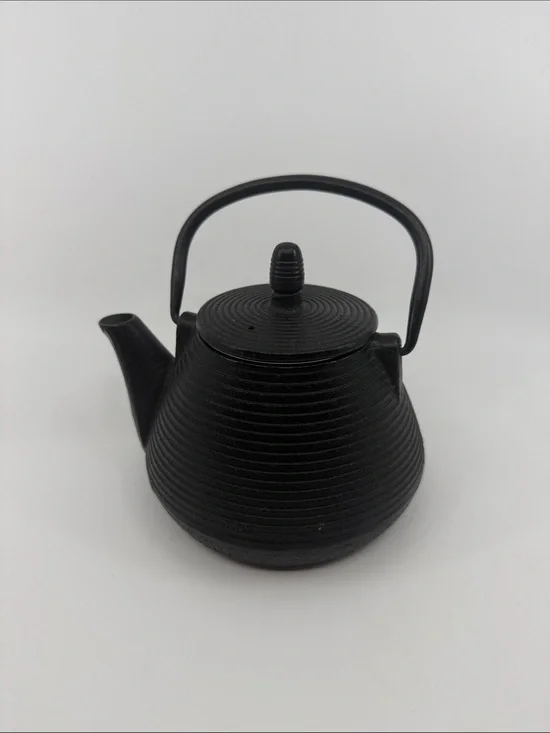 Elegant Black Cast Iron Teapot with Textured Finish
