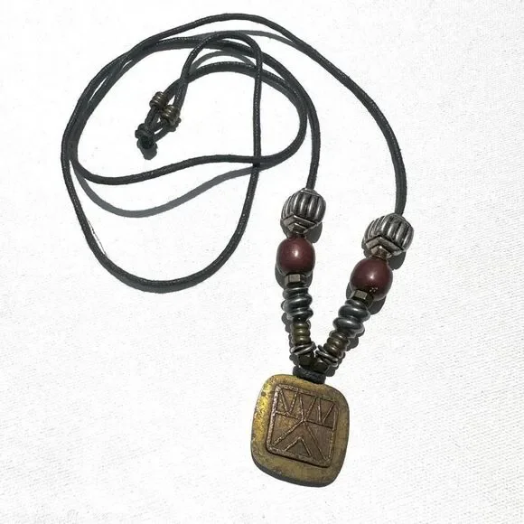 Baer SF sterling silver and brass pendant necklace on black cord