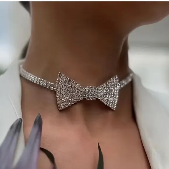 Dazzling crystal bow centerpiece on a sparkling choker. Elegant, eye-catching.