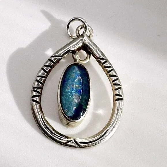 Marked Sterling‎ silver (HTS) and opal in resin pendant!