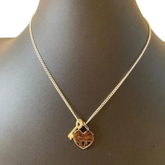 Gun Metal Heart Shaped Lock w/ Gold Tone Key on Serpentine Chain.