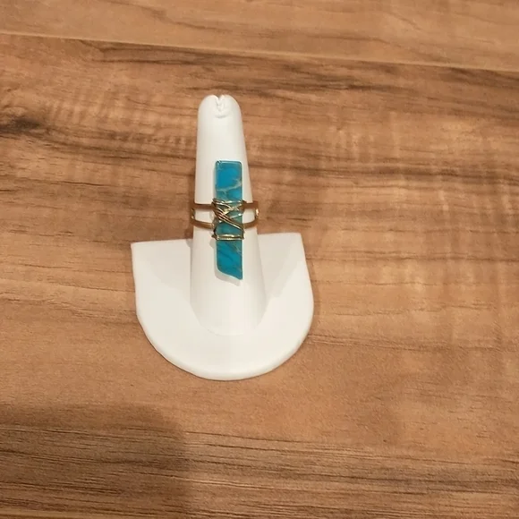 Super cute gold wire wrapped faux turquoise adjustable ring.