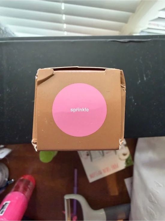 RHODE Satin Buildable Color in Brown Packaging with Pink Accent