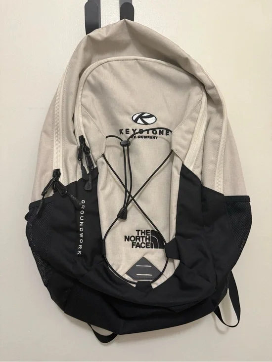 The North Face Two-Tone Beige and Black Backpack with Bungee Front