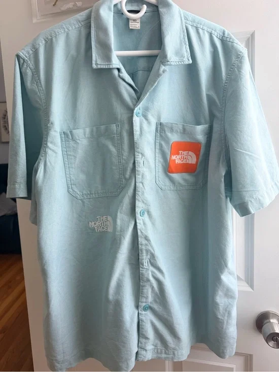 The North Face Light Blue Short-Sleeve Button-Up Shirt with Orange Logo