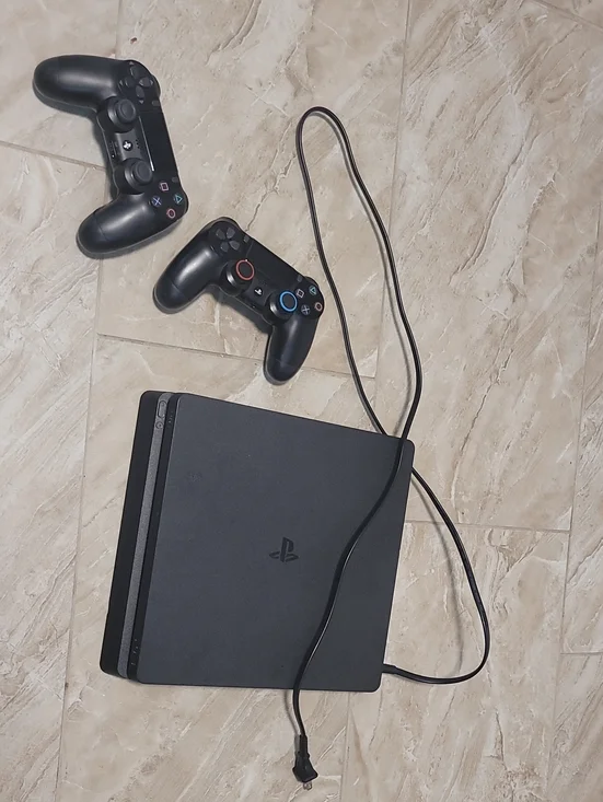 Sony Black PS4 Slim Console with Two Black DualShock Controllers