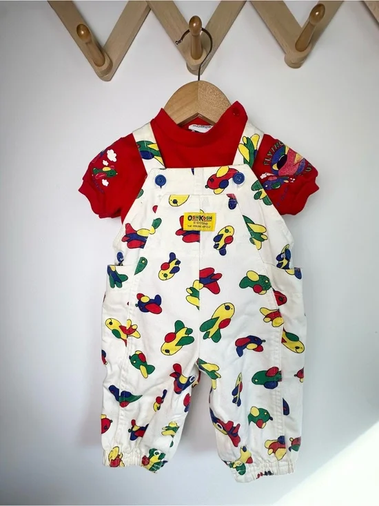 OshKosh B'gosh White Overalls with Colorful Airplane Print and Red Accents