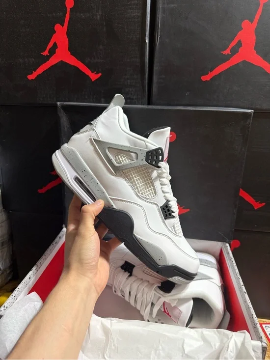 Jordan 4 Retro White Cement Athletic Sneakers in White and Gray