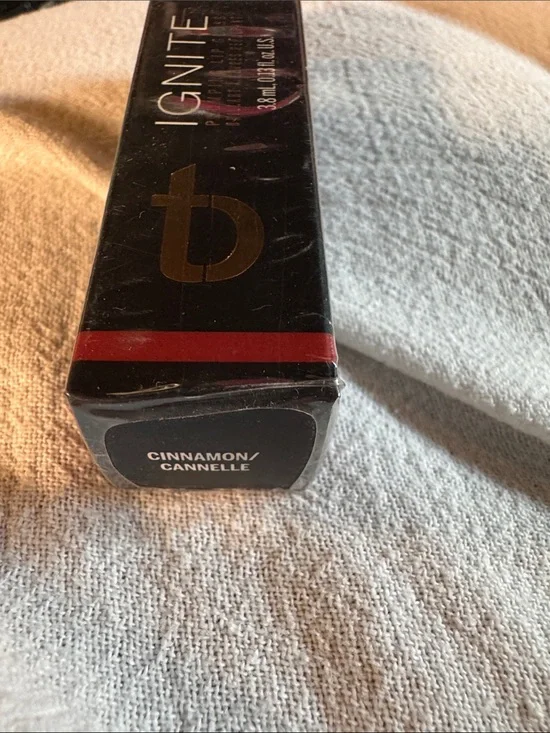 Ignite Lip Plumping Lip Gloss in Cinnamon - Deep Redish/ Gold Shade