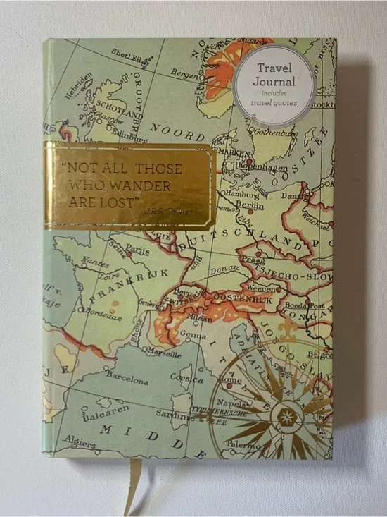 Travel Journal with map design and quote from J.R.R. Tolkien