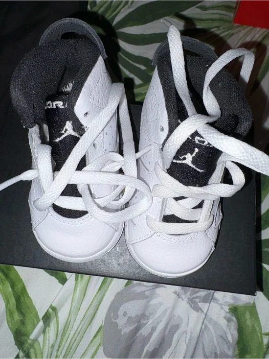 Nike Baby White and Black High-Top Sneakers one sole is missing