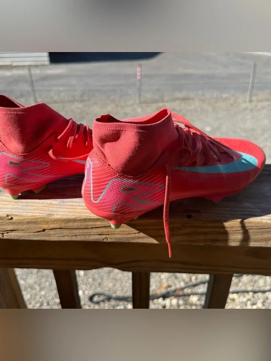 Nike Red Kids Soccer Cleats with Teal Swoosh