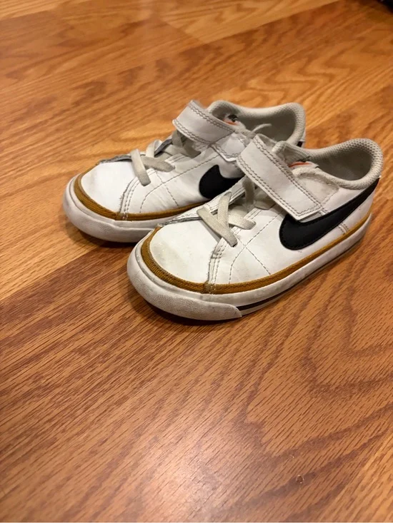 Nike Kids White Sneakers with Black Swoosh and Brown Accent