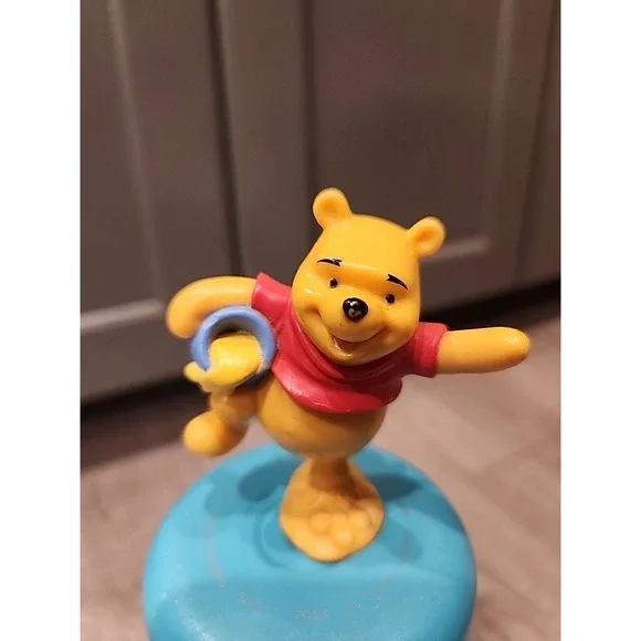 Winnie the pooh standing on one leg holding honey pot plastic‎ toy Cake Topper