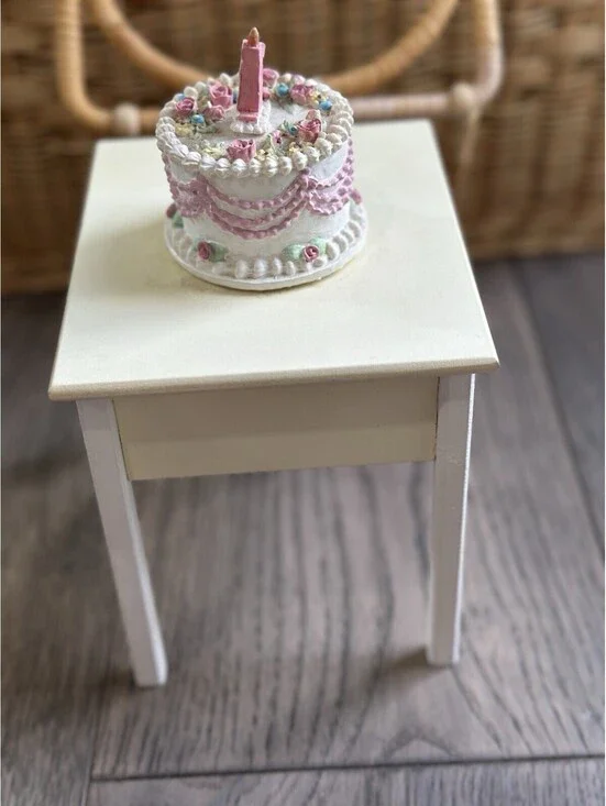 Musical vintage-style birthday cake features delicate pastel floral decorations