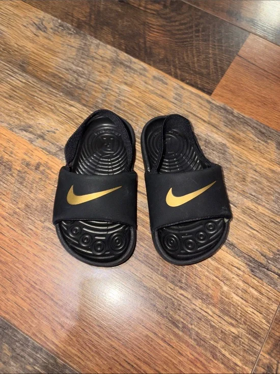 Nike Kids Black Slide Sandals with Gold Swoosh‎ Accent