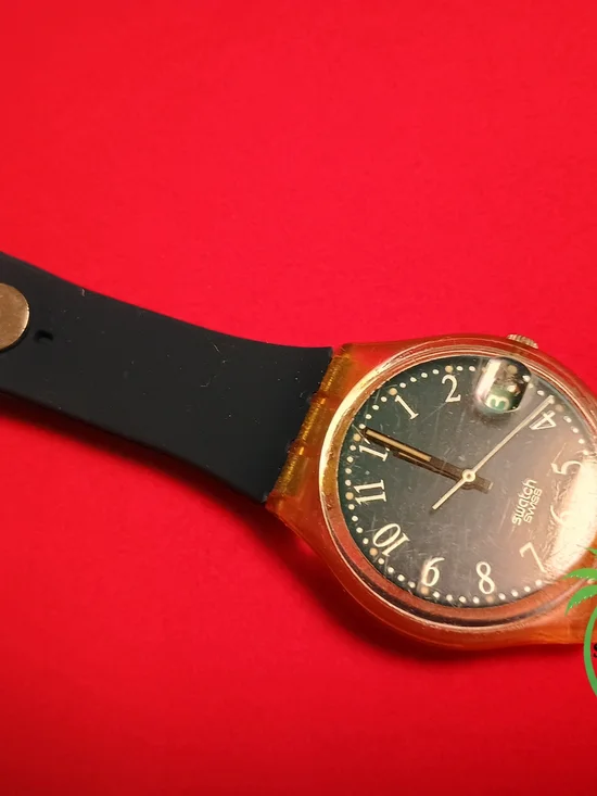 Swatch Black Dial Watch with Amber Transparent Case and Black Strap