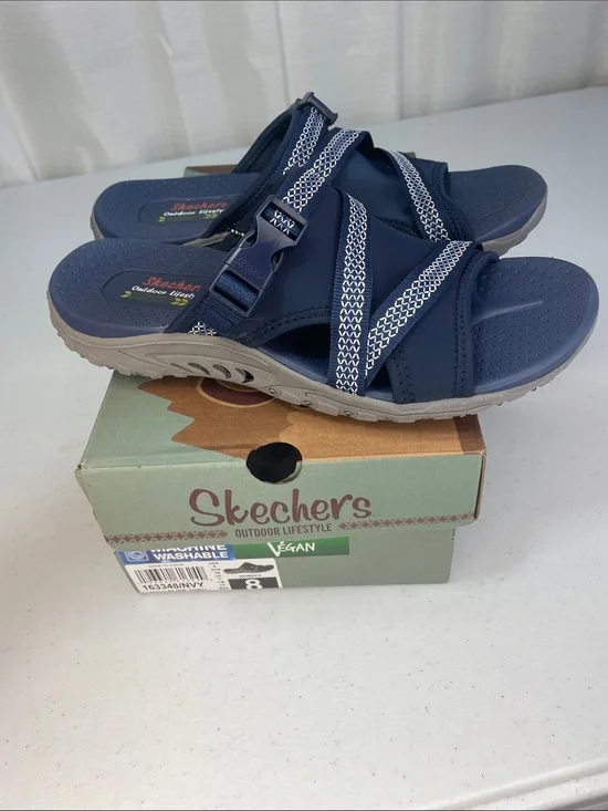 Skechers women’s Navy and White Slip-On Sport Sandals