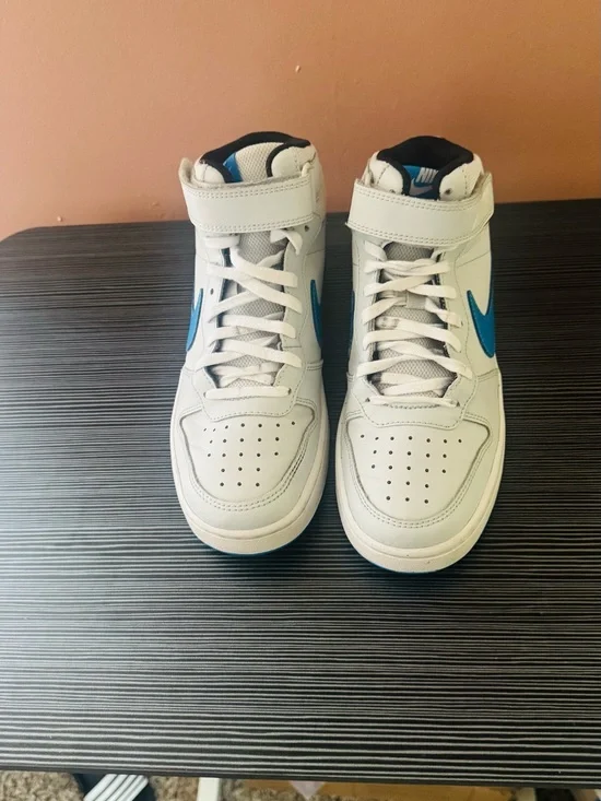Nike White High-Top Sneakers with Blue Swoosh Accents