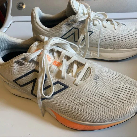 New Balance womens Neutral Running Shoes - Cream with Orange Accents