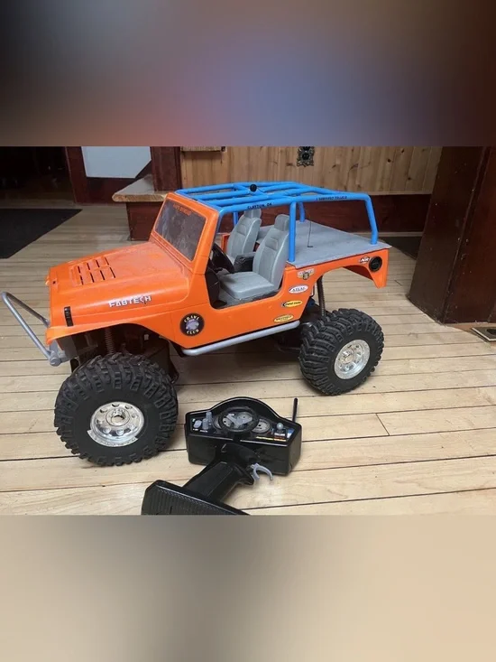 Bright 1:10 Scale Orange Jeep Wrangler Rock Crawler RC Truck with Remote⁠