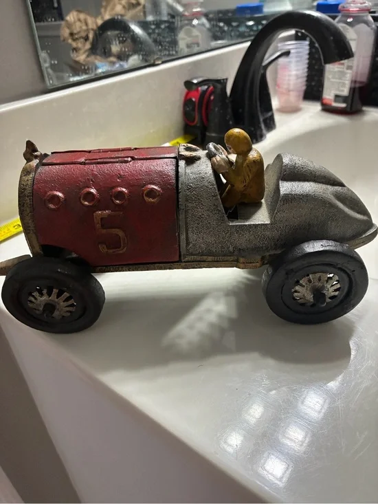 Vintage -style decorative cast iron race car modeled after Hubley racers