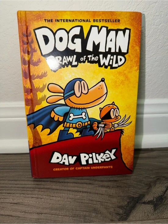 Scholastic Dog Man Hardcover with bright yellow and red cover