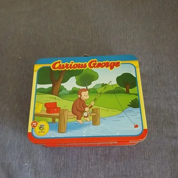 Curious George  Jizsaw puzzle 24 pieces in metal Tin Used