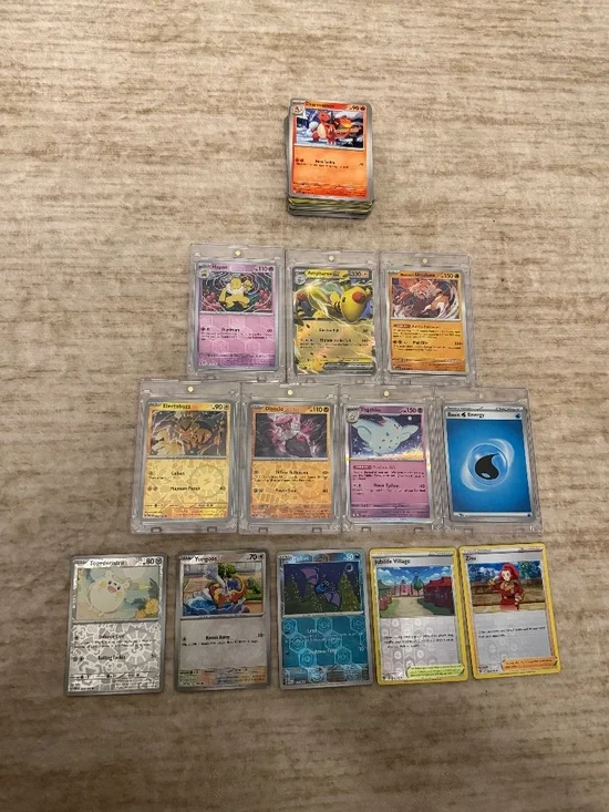 Bundle of 100 Pokemon cards - 12 Holographic Cards, 7 with PSA Looking Case Incl