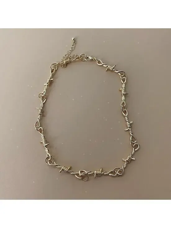 Y2k gold barbwire opium punk style chocker necklace. Cool design. Nice quality.