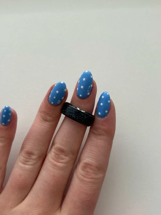 black detailed ring with blue sparkles on the inside